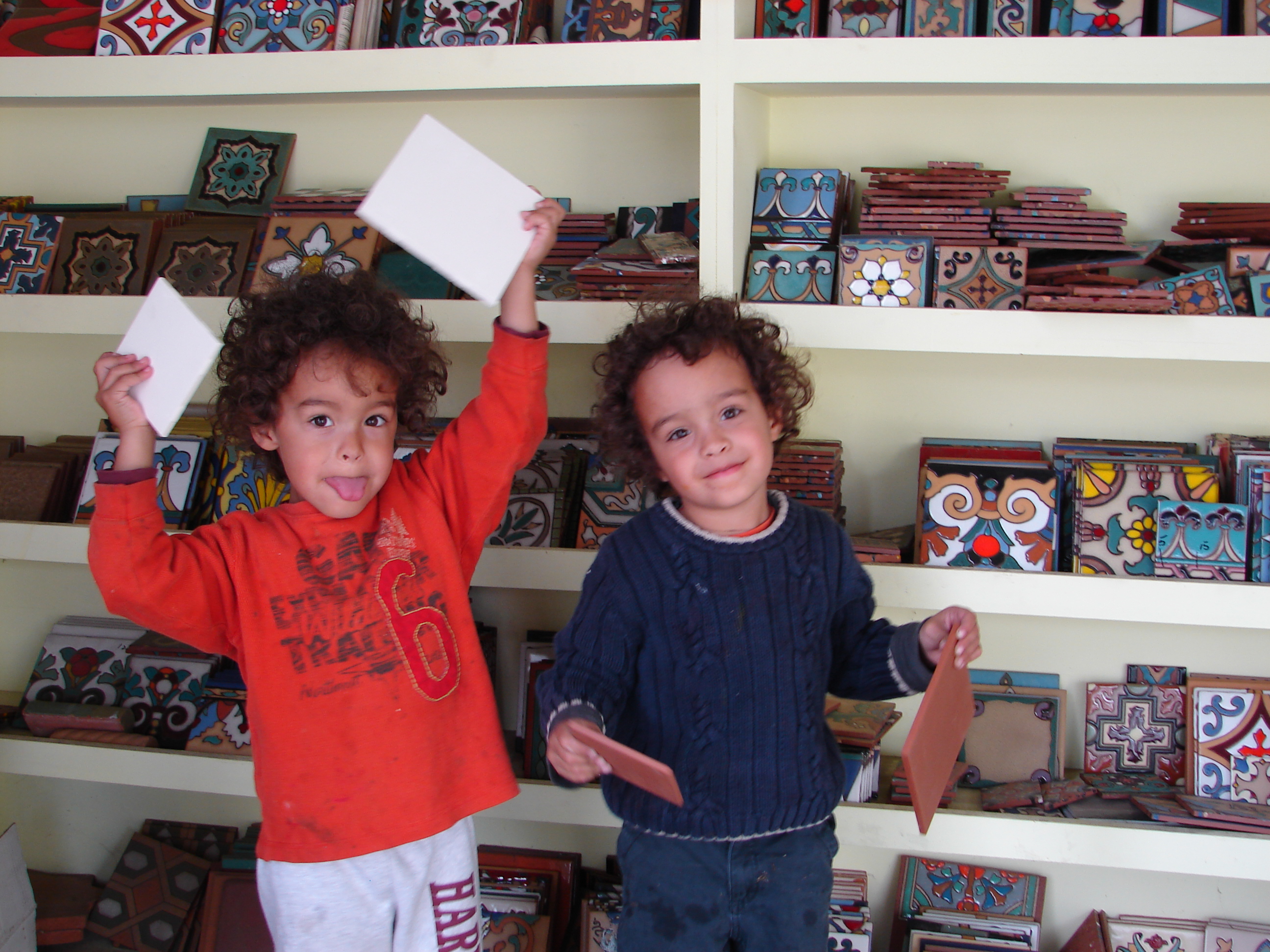 hand-painted ceramic tiles- kids holding  White Bisque and Quarry tiles